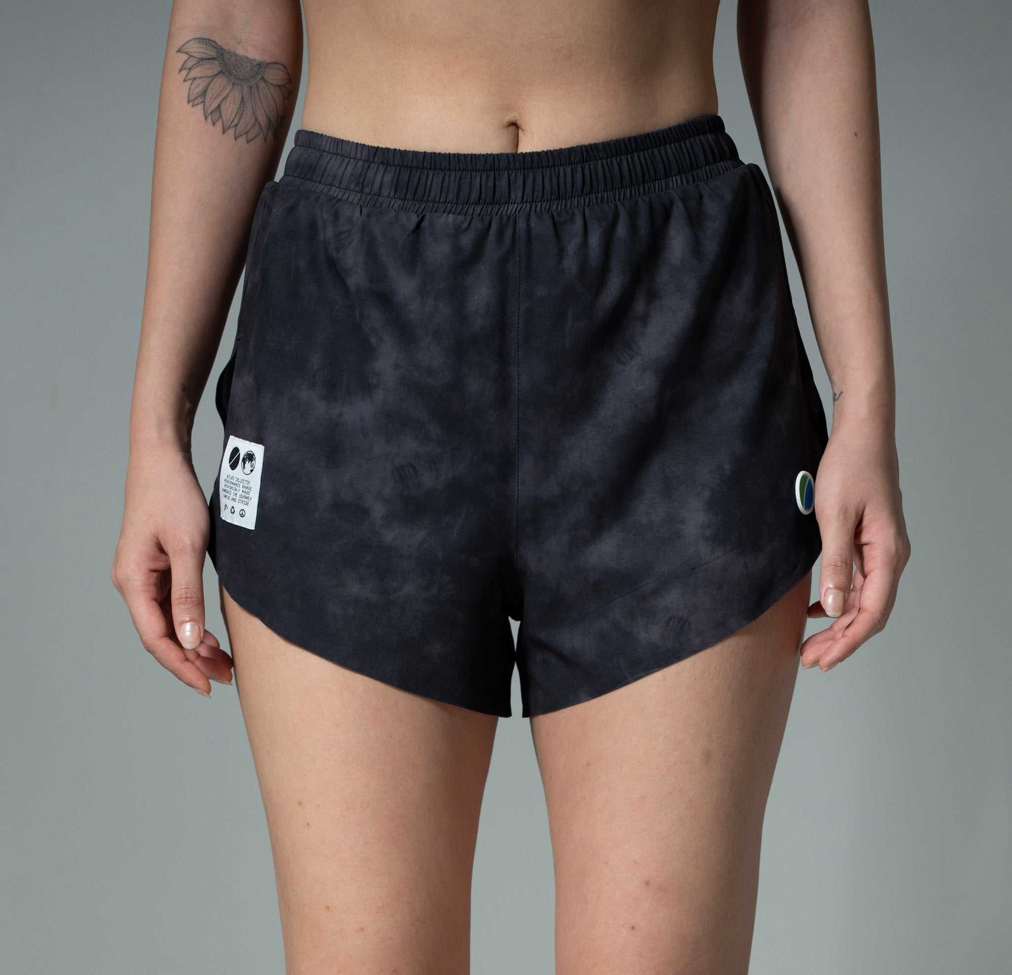 Women's V3 Core WMNS black tie-dye running shorts, recycled polyester, split-cut design.